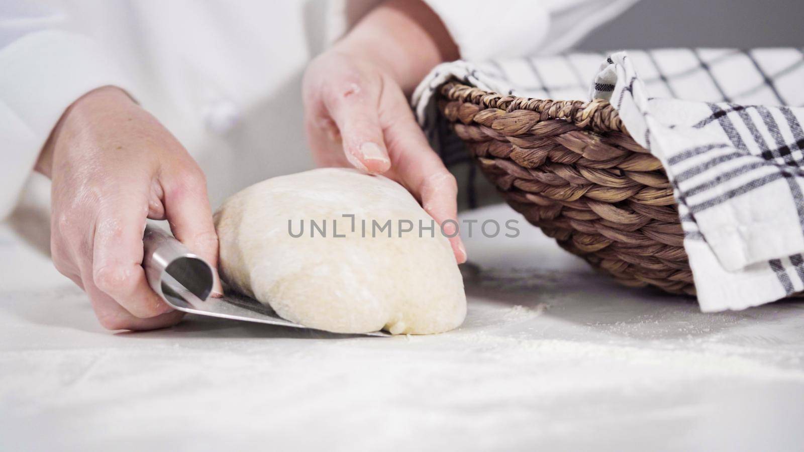 Knitting dough by hand to bake cinnamon rolls.