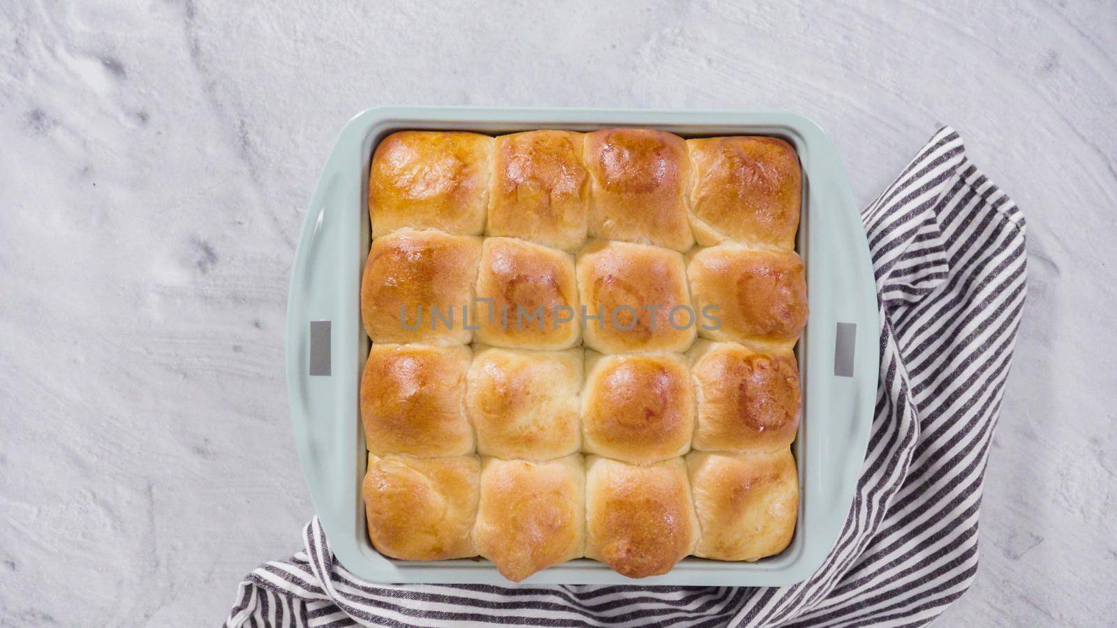 Flat lay. Preparing dinner rolls from the frozen dough in baking pan.