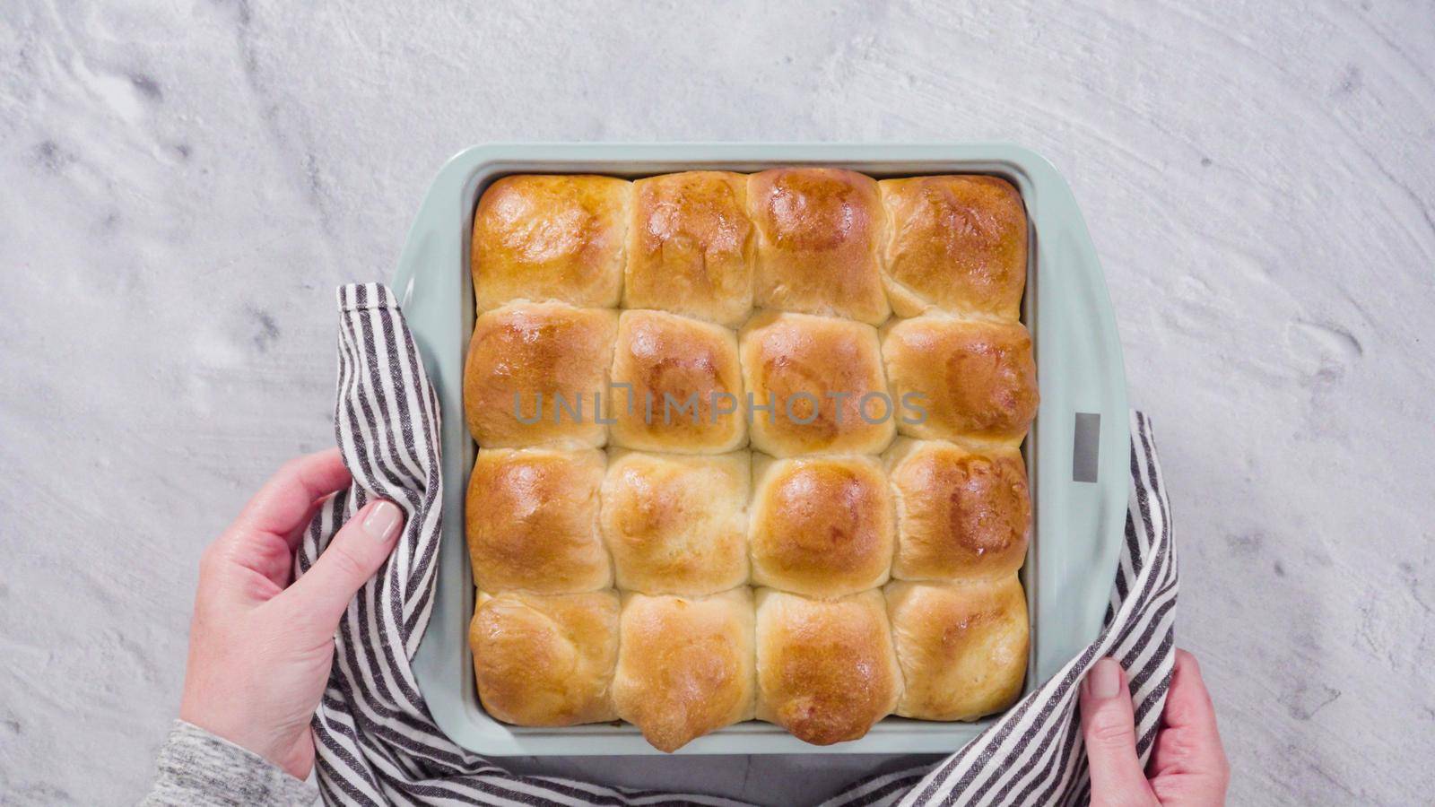 Flat lay. Preparing dinner rolls from the frozen dough in baking pan.