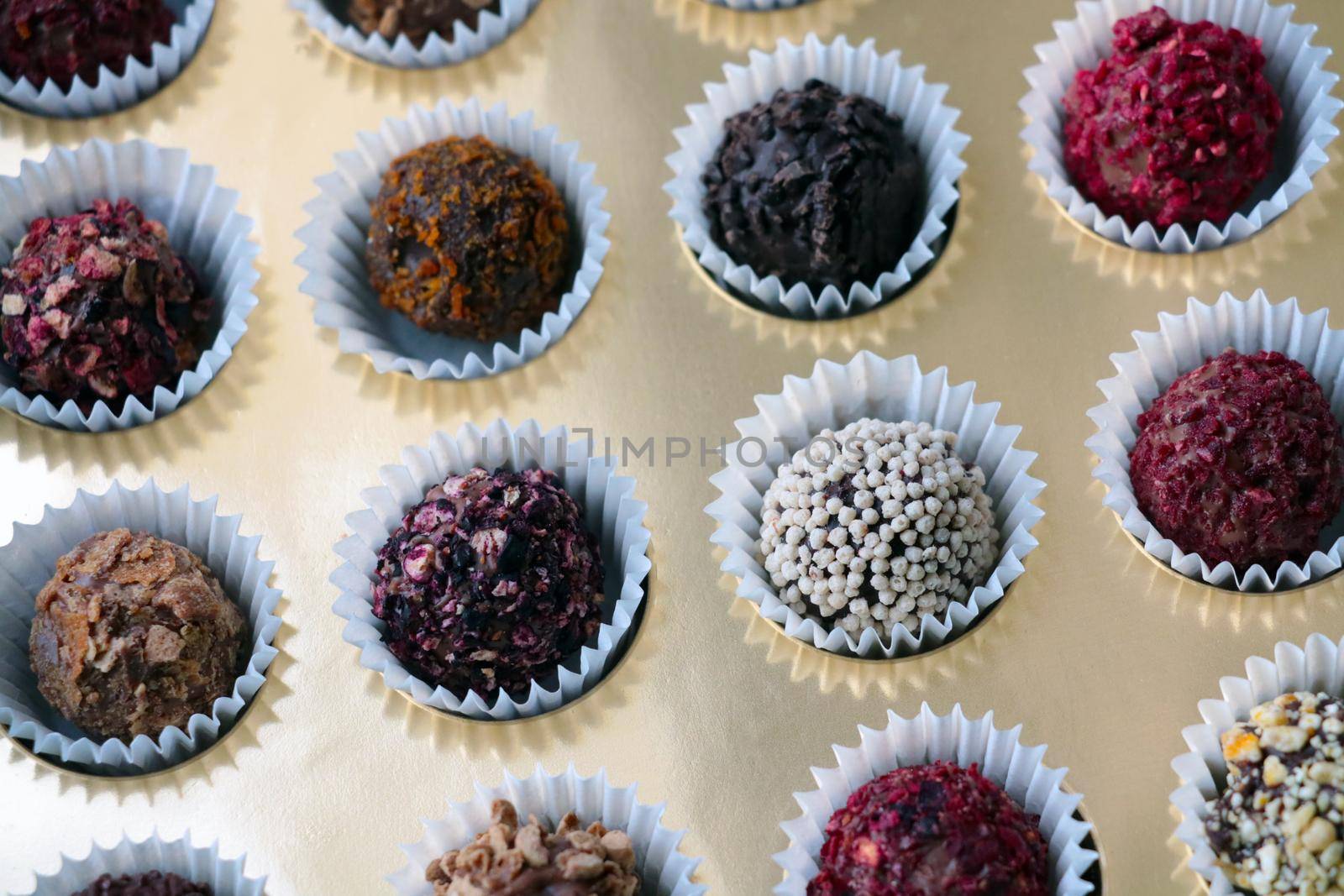 Different beautiful tasty candies in a box. Candy background