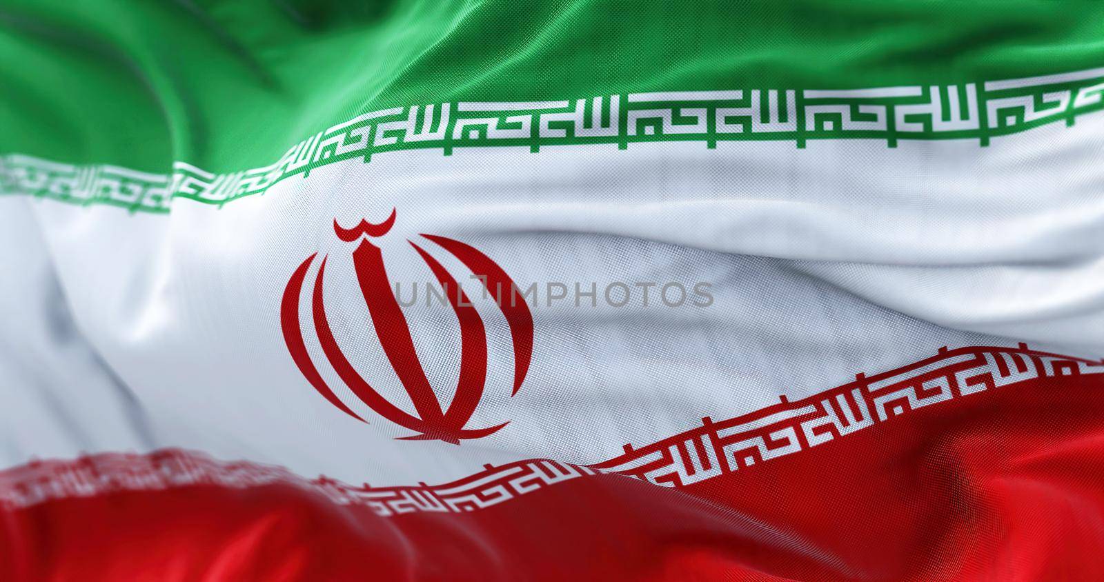 Close-up view of the Iran national flag waving in the wind by rarrarorro