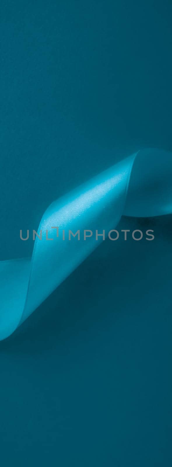 Branding, holidays and luxe brands concept - Abstract silk ribbon on aqua blue background, exclusive luxury brand design for holiday sale product promotion and glamour art invitation card backdrop