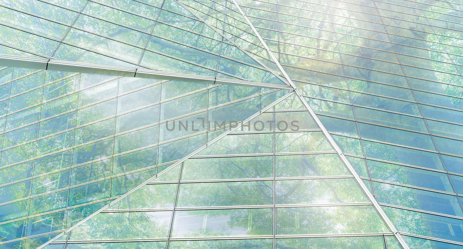 Sustainble green building. Eco-friendly building. Sustainable glass office building with tree for reducing carbon dioxide. Office with green environment. Corporate building reduce CO2. Safety glass. by Fahroni