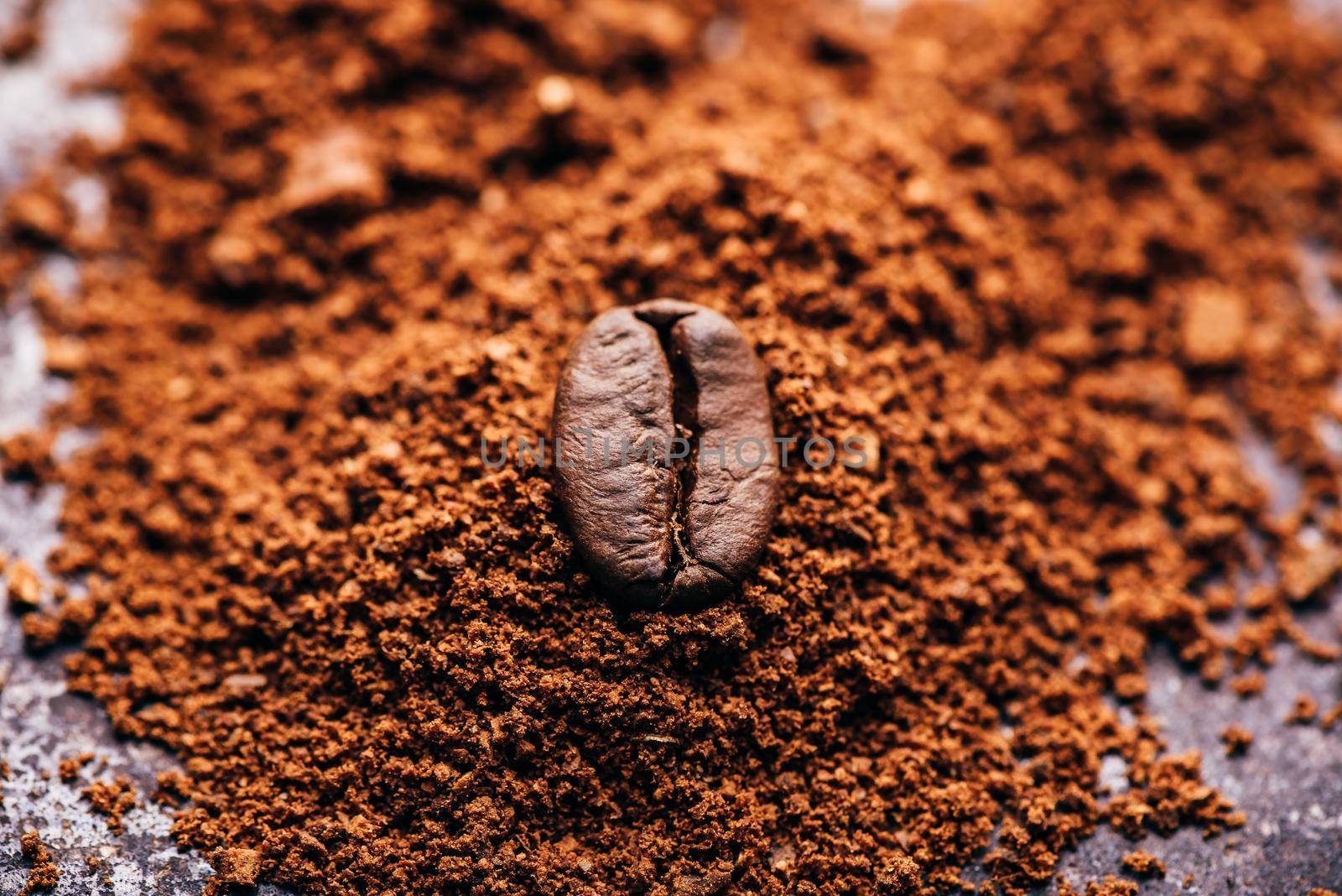 Coffee bean on heap of grinded coffee by Seva_blsv