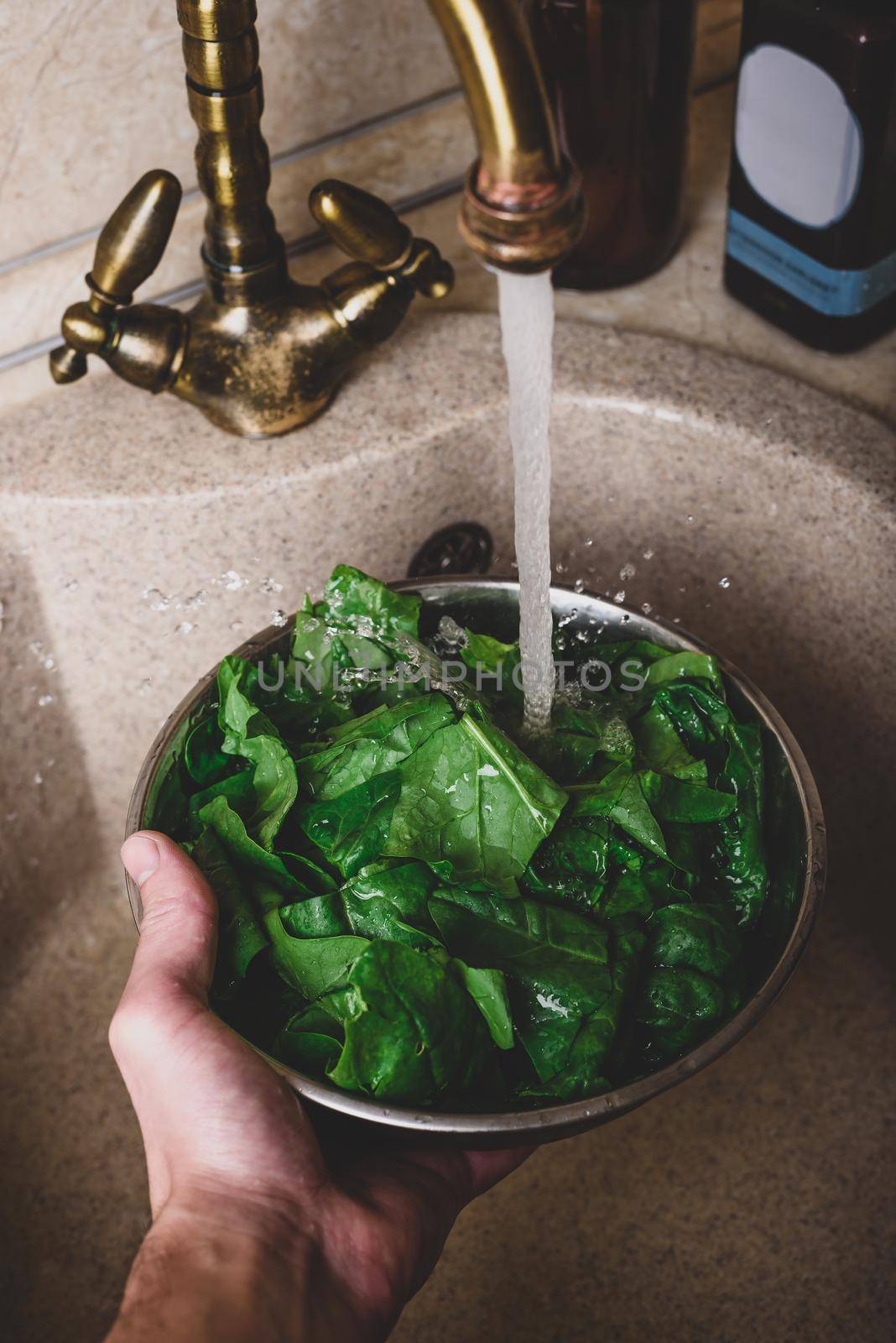 Washing Fresh Spinach Leaves in Sink by Seva_blsv