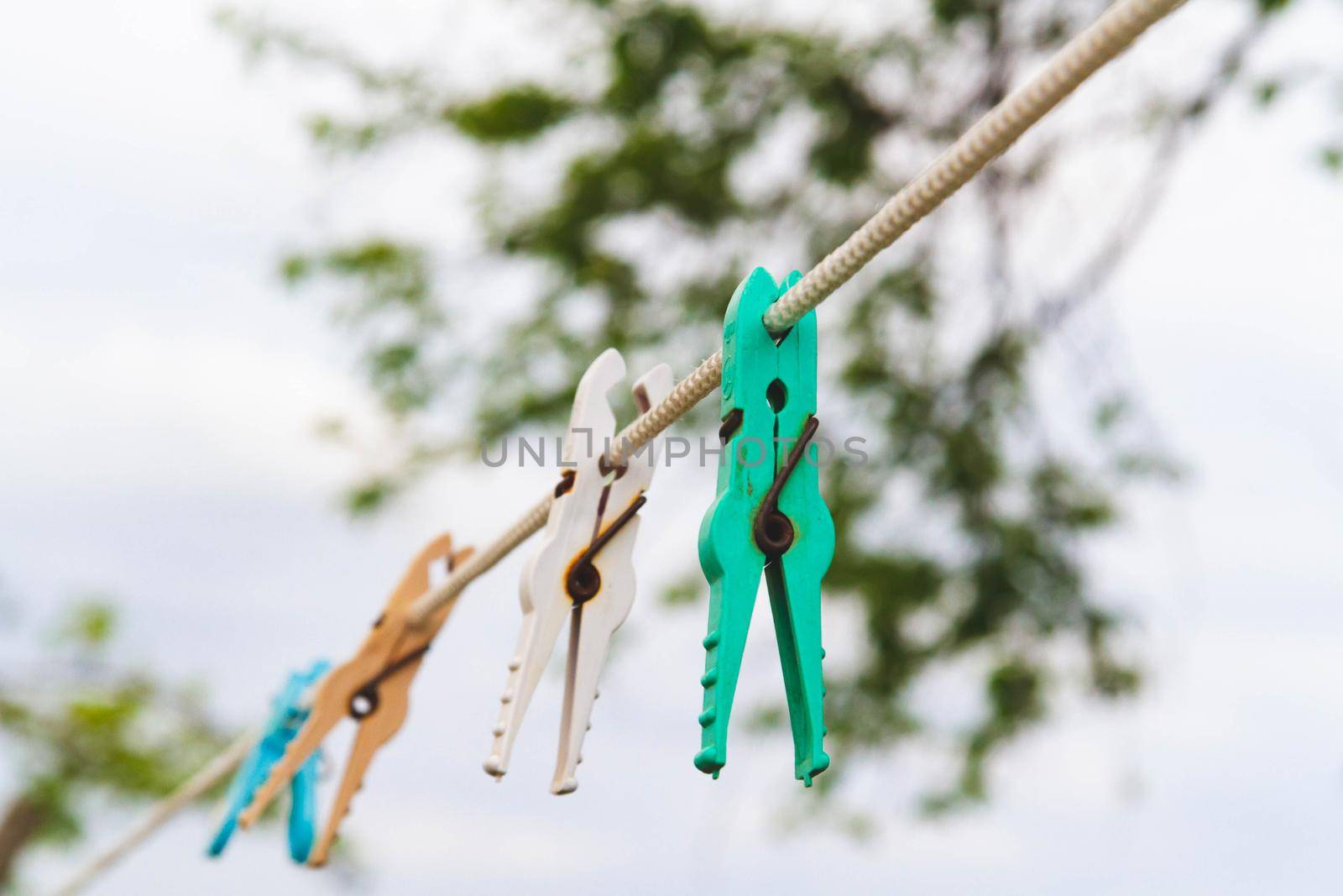 Clothespins for drying clothes on a rope. Clothesline . Laundry washing and drying outside.