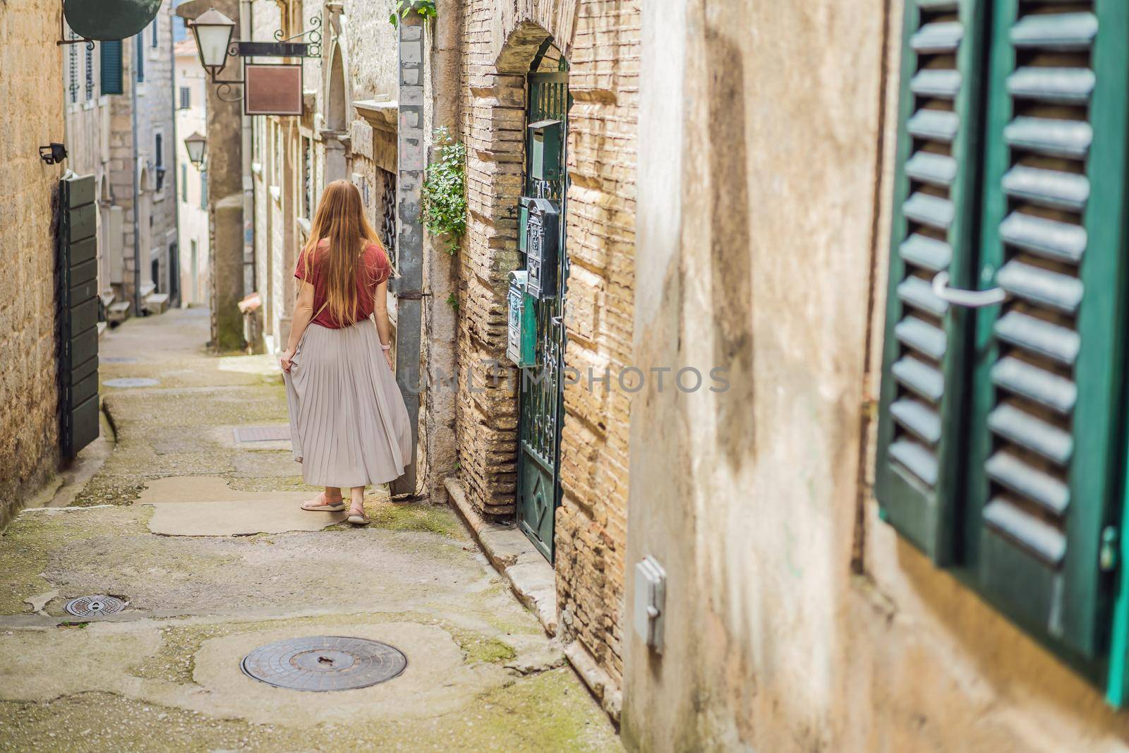 Woman tourist in Herceg Novi old town. Historical and touristic center of Herceg Novi. Montenegro.