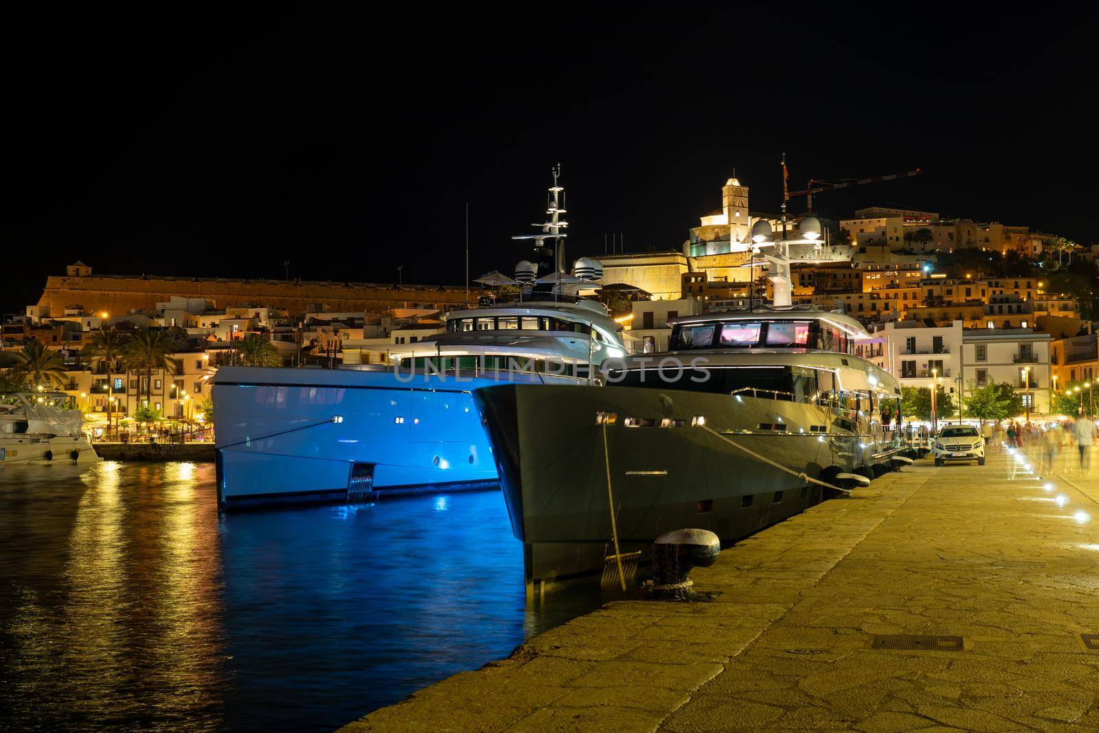 Huge yachts in the port of Ibiza at night