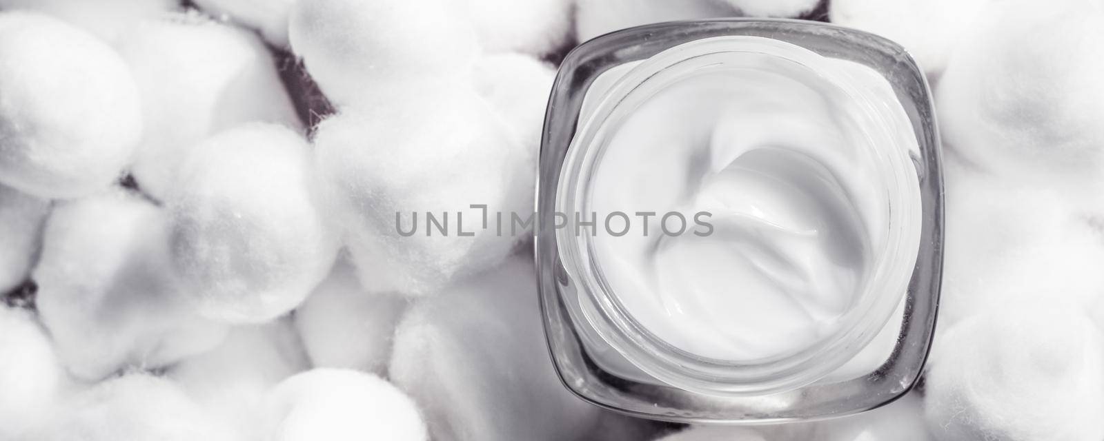 Cosmetic branding, moisturizing emulsion and facial care concept - Luxury face cream for sensitive skin and white cotton balls on background, spa cosmetics and natural skincare beauty brand product