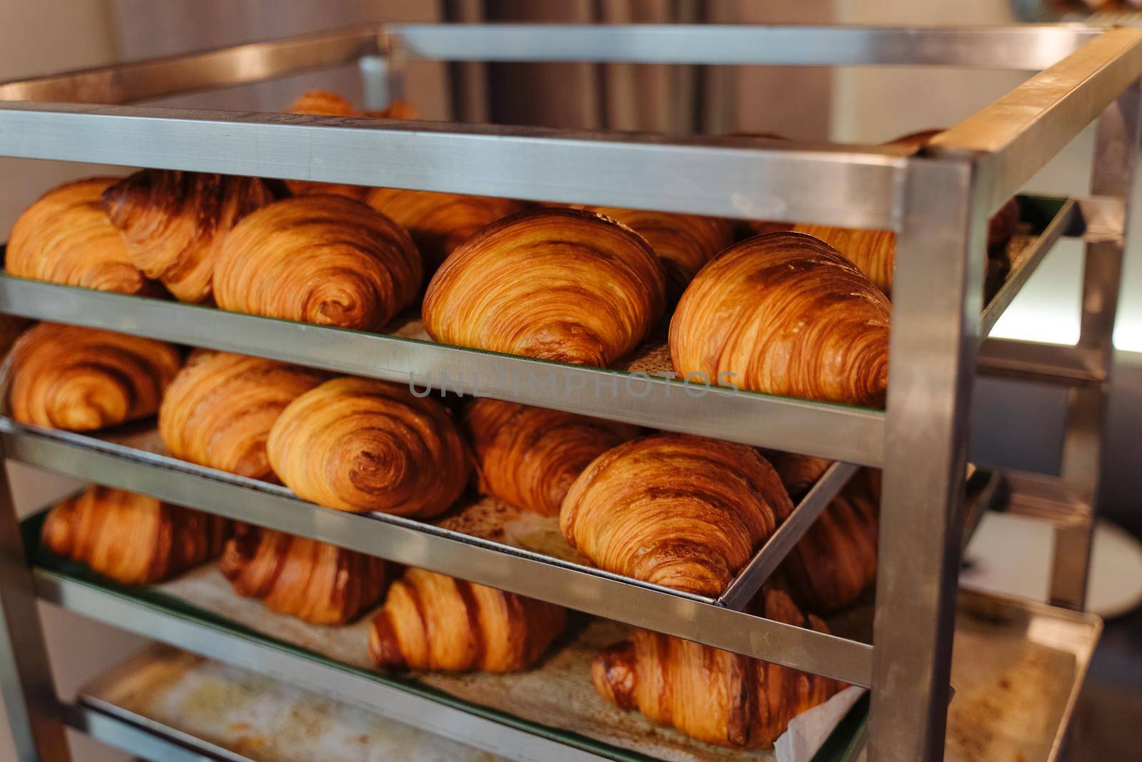 Bun production. Family bakery. Hot croissants only from the oven. Fresh bakery.