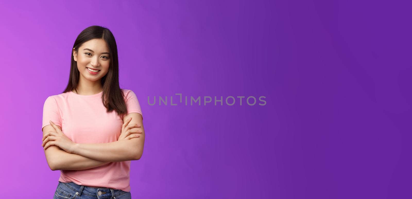 Assertive good-looking female entrepreneur young girl starting own business, feel encouraged, confidently smiling, cross arms chest, talking llively friends, stand purple background joyful.