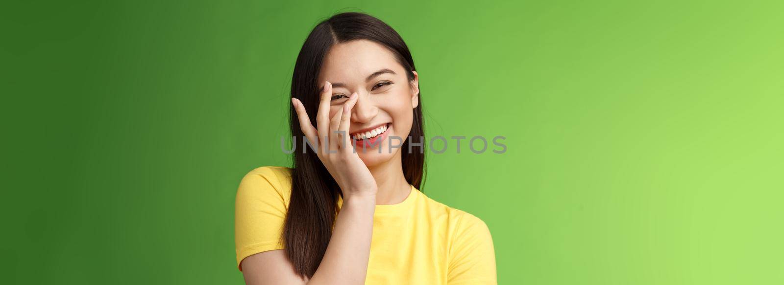 Waist-up sincere happy cheerful tender feminine asian woman brunette, laughing carefree smiling, enjoy entertaining company, giggle, touch face shy blushing cute compliments, gree background.