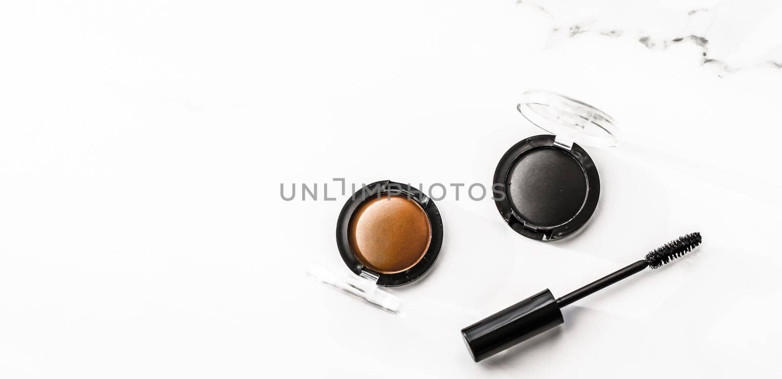 Cosmetic branding, blog and girly concept - Eyeshadows, black liner and mascara on marble background, eye shadows cosmetics as glamour make-up products for luxury beauty brand, holiday flatlay design