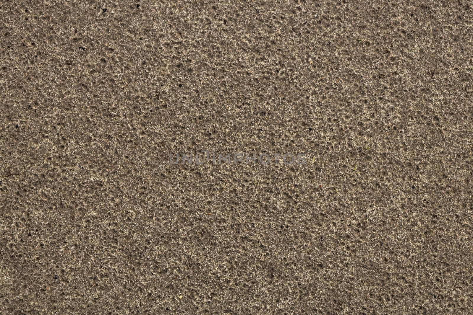 Sand after rain top view background texture pattern. High-quality photo