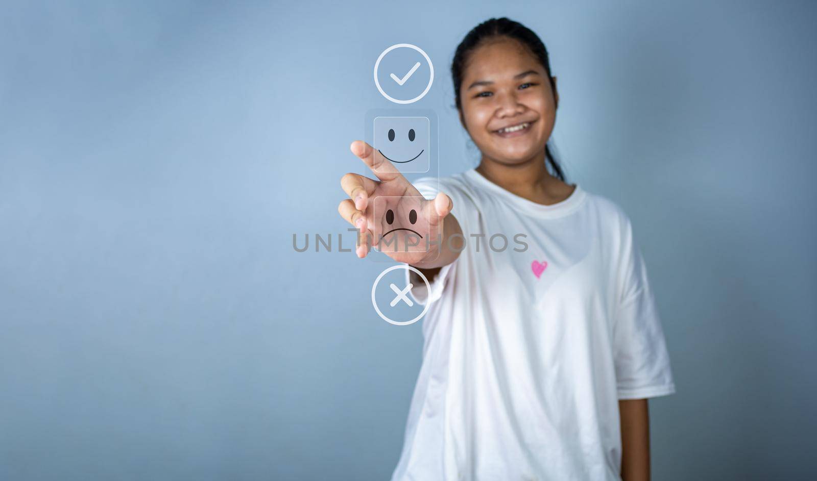 Hand choosing happy smile icon. represents feedback rating and positive customer review, Satisfaction Concept, satisfaction survey ,mental health assessment, world mental health day, think positive concept.