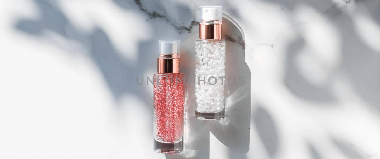 Cosmetic branding, packaging and make-up concept - Skin care serum and gel bottle, moisturizing lotion and lifting cream emulsion on marble, anti-age cosmetics for luxury beauty skincare brand design