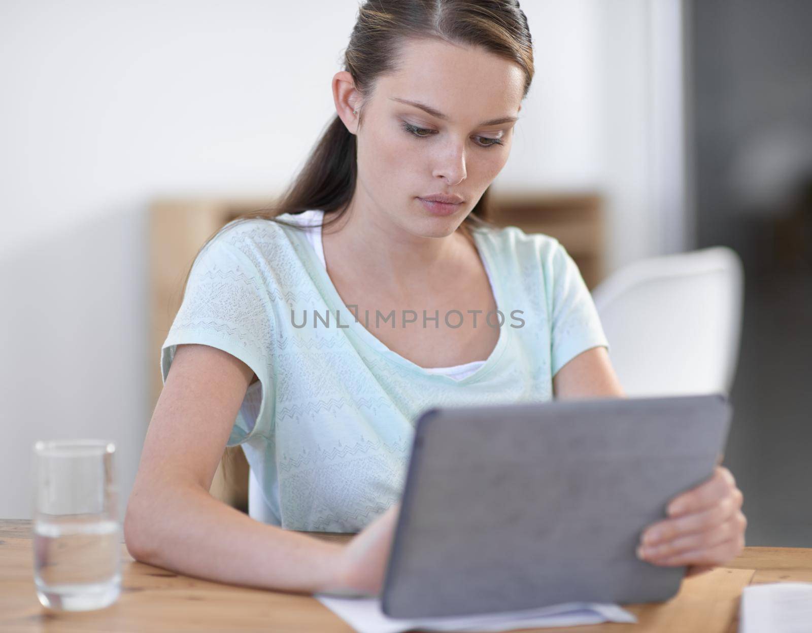 Using technology to get the job done. an attractive young businesswoman using a wireless device