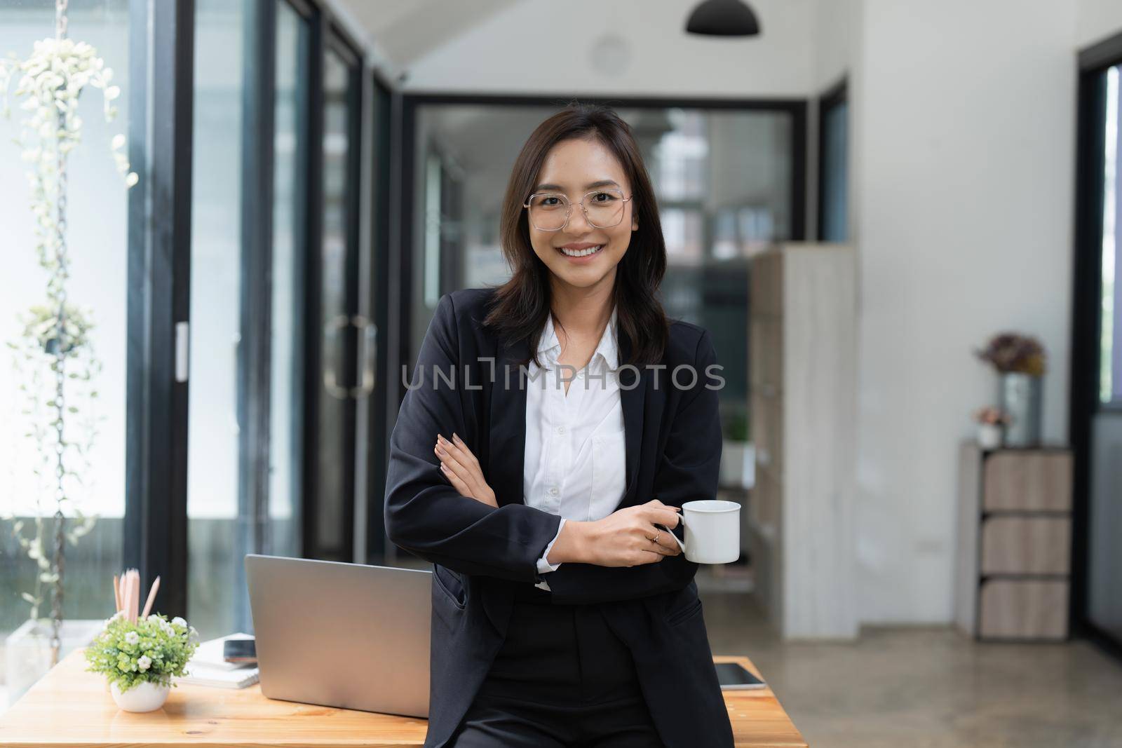 Smart asian business woman smiling at office space. real estate, lawyer, non-profit, marketing by itchaznong