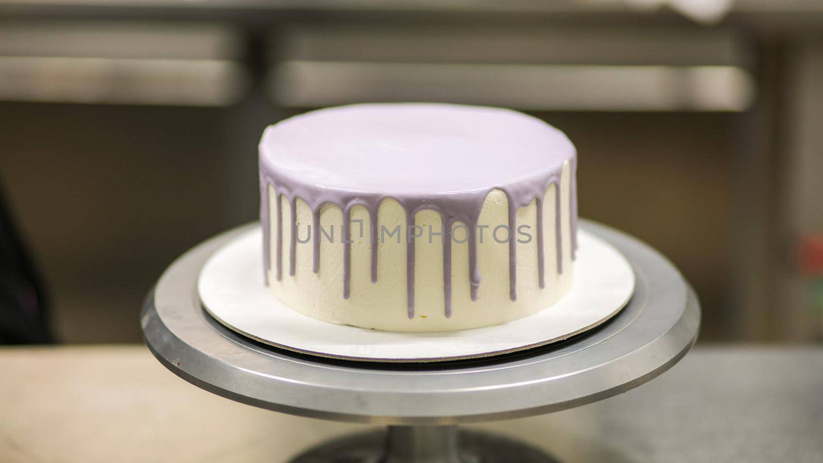 White lilac blank butter cream Frosted cake ready to decorated by cake desginer by verbano