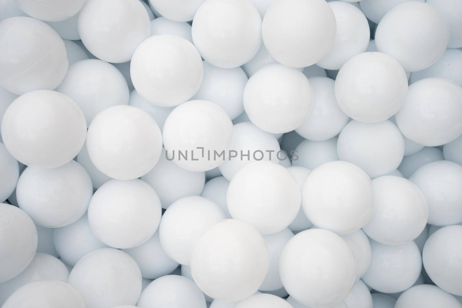 Many white plastic balls for dry pool in amusement park