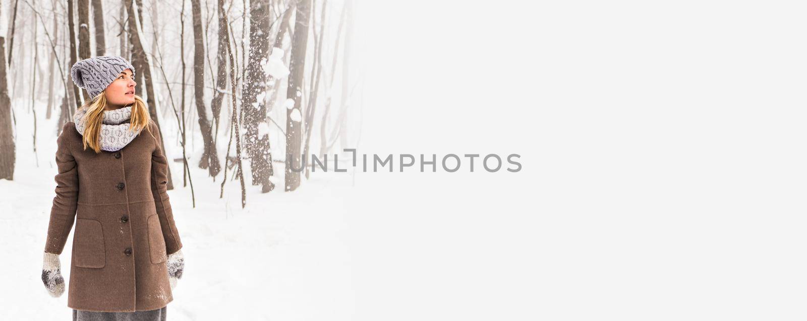 Banner attractive young woman in wintertime outdoor copy space. Christmas time by Satura86