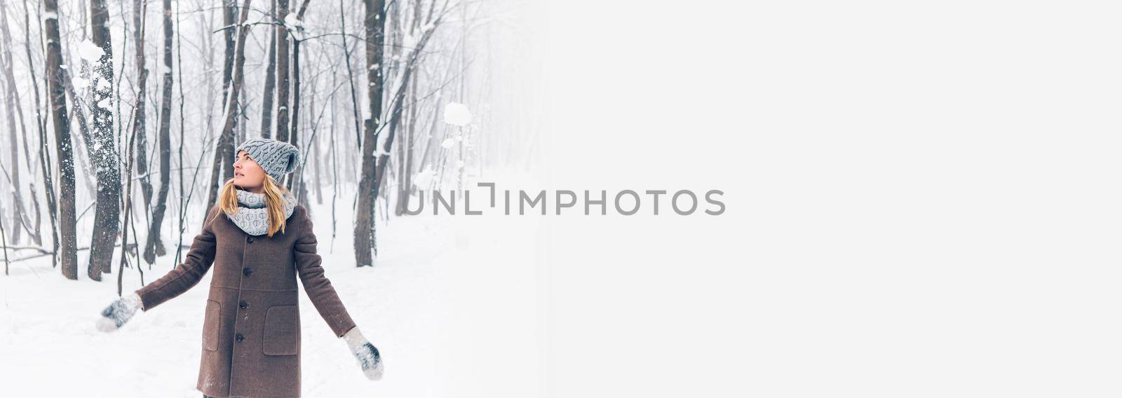 Banner beautiful young girl in winter snow forest copy space by Satura86