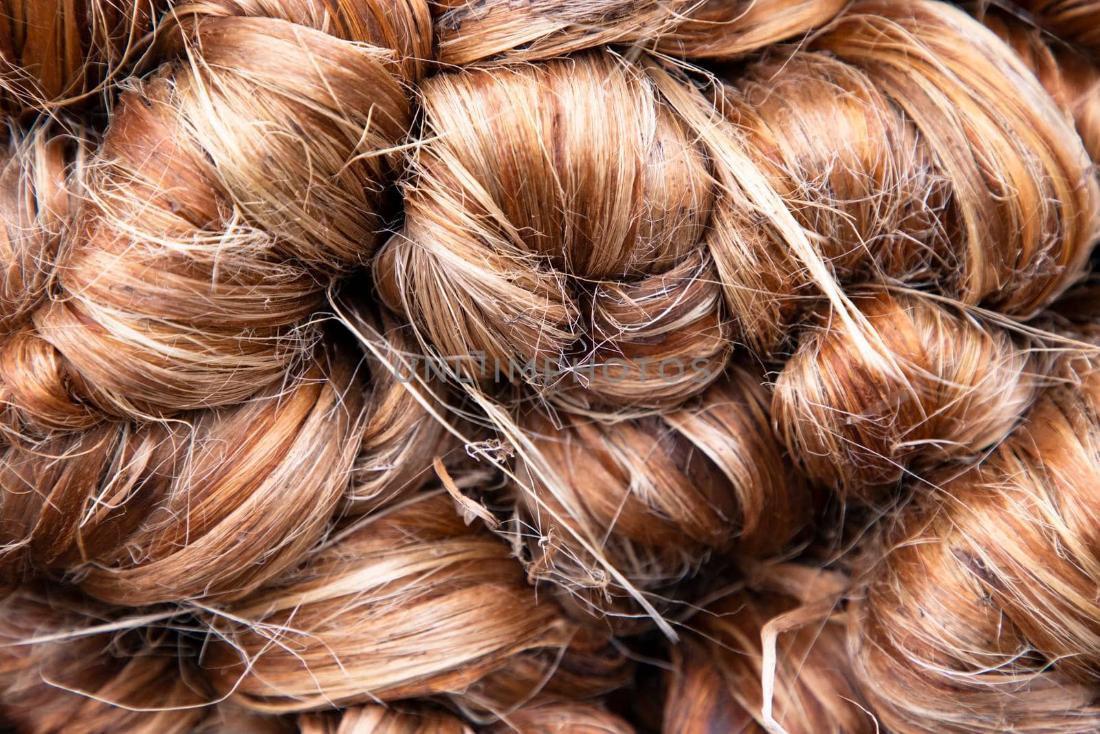 Thick Golden bundle of Wet raw jute fiber Texture Background