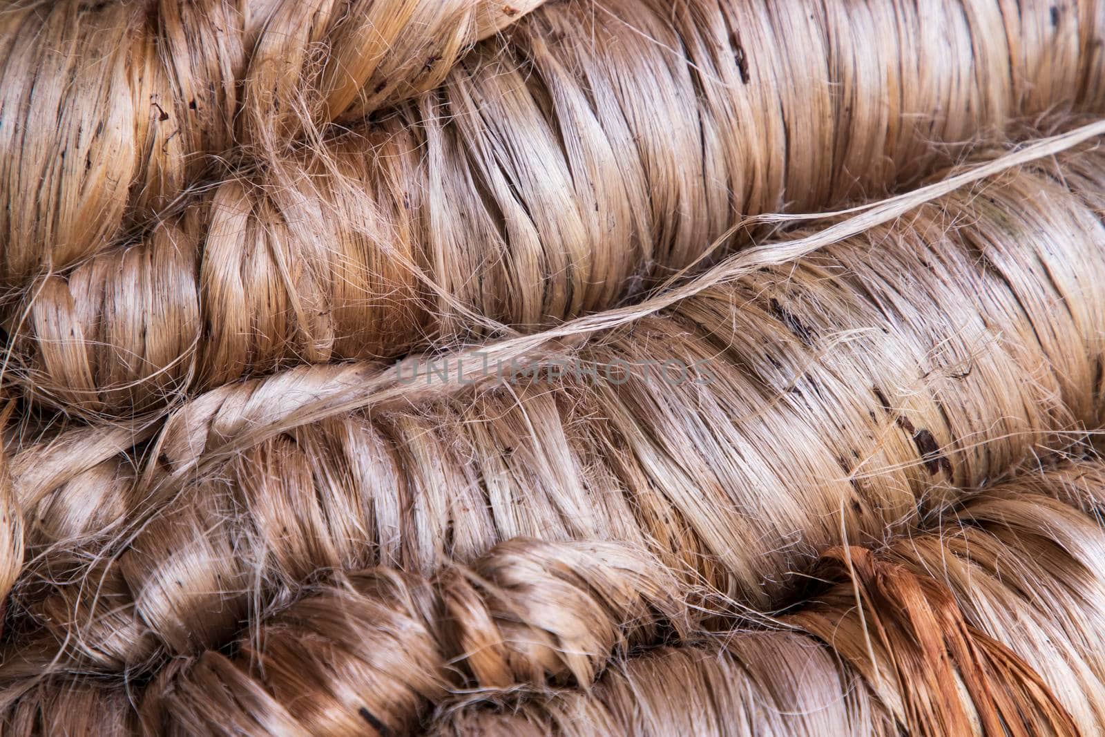 A thick bundle of Golden jute fiber Texture Background