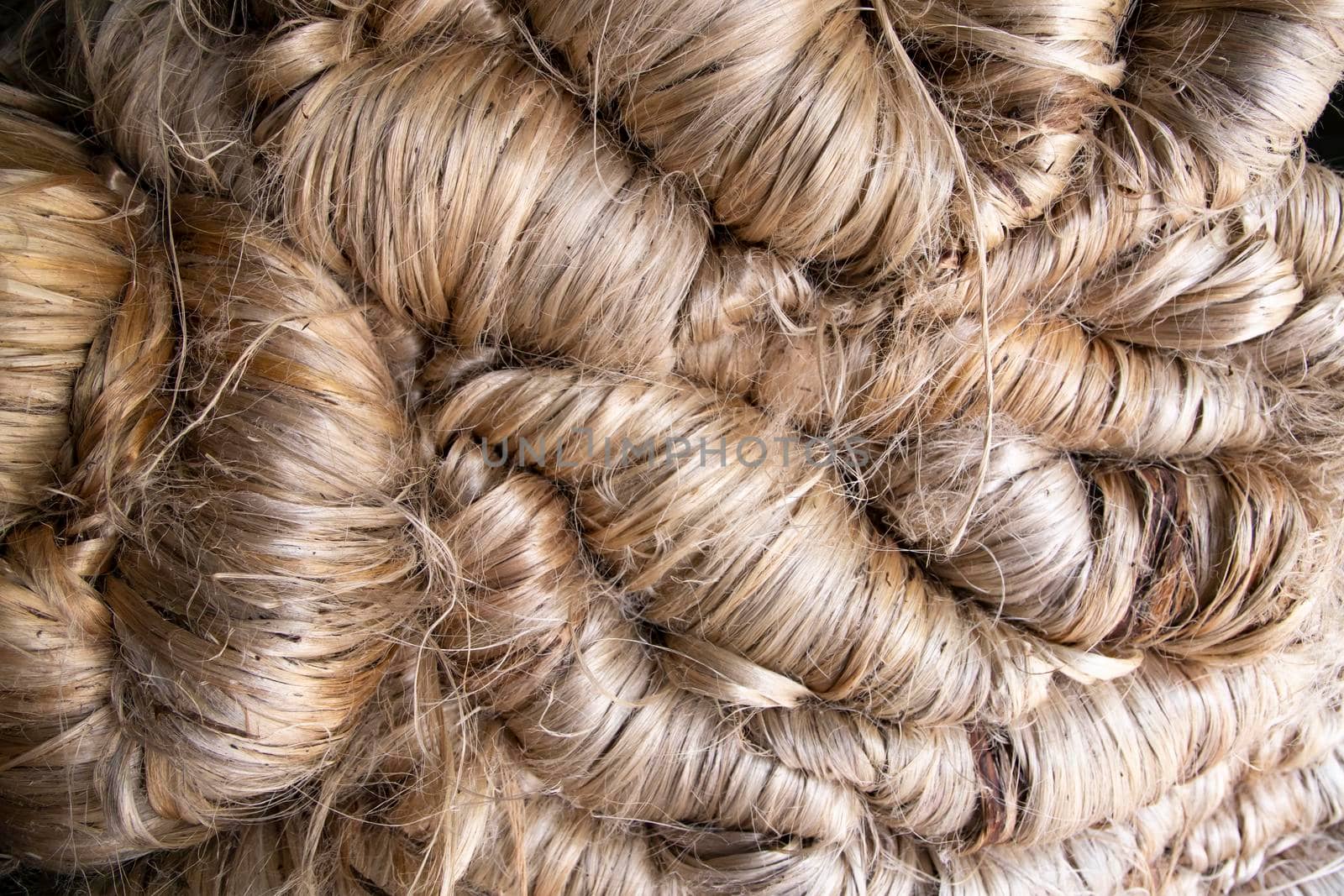 A thick bundle of Golden jute fiber Texture Background