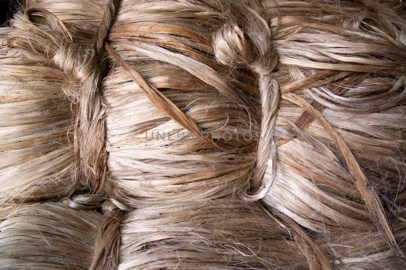 A thick bundle of Golden jute fiber Texture Background