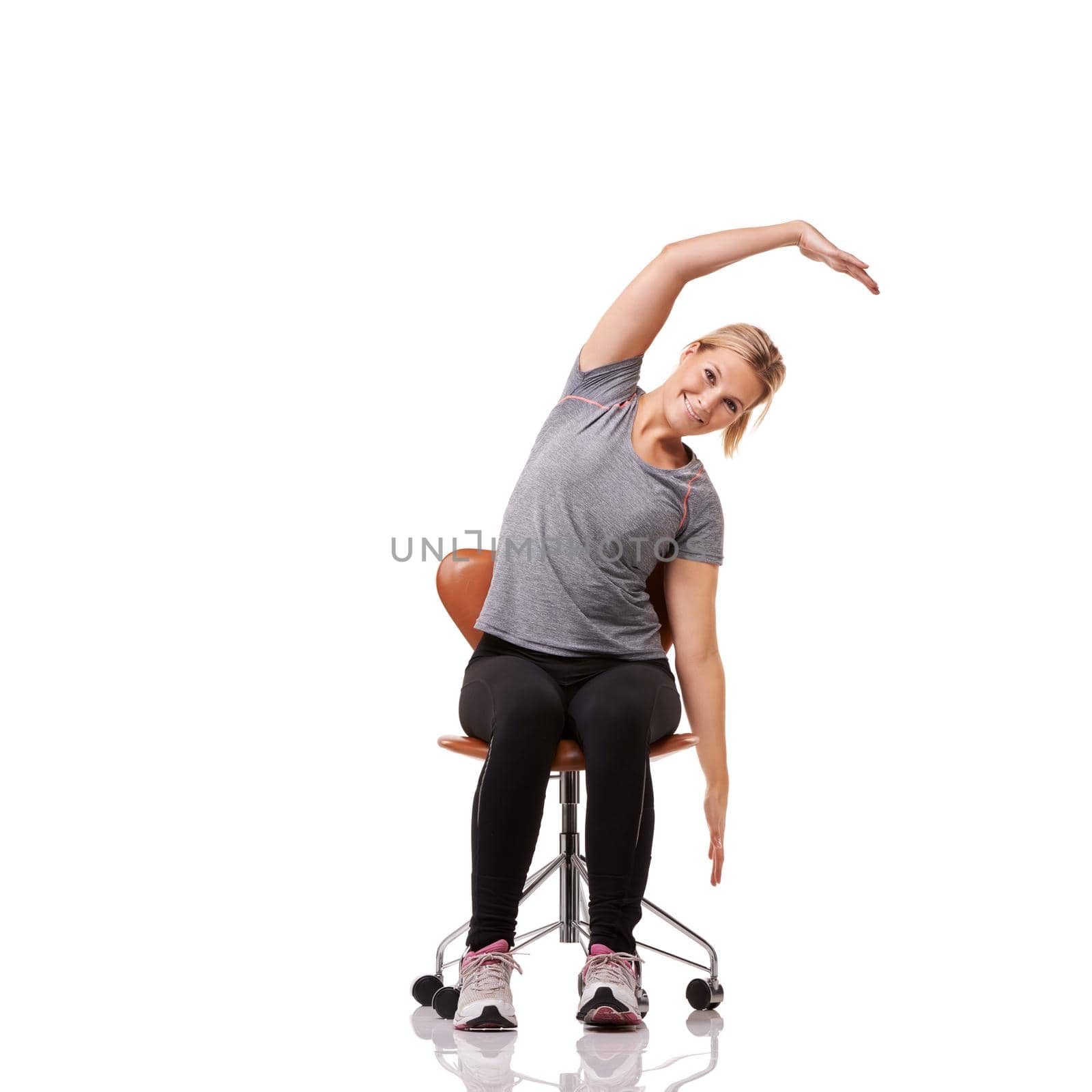 Perfect for your posture. a sporty woman doing stretches on a chair