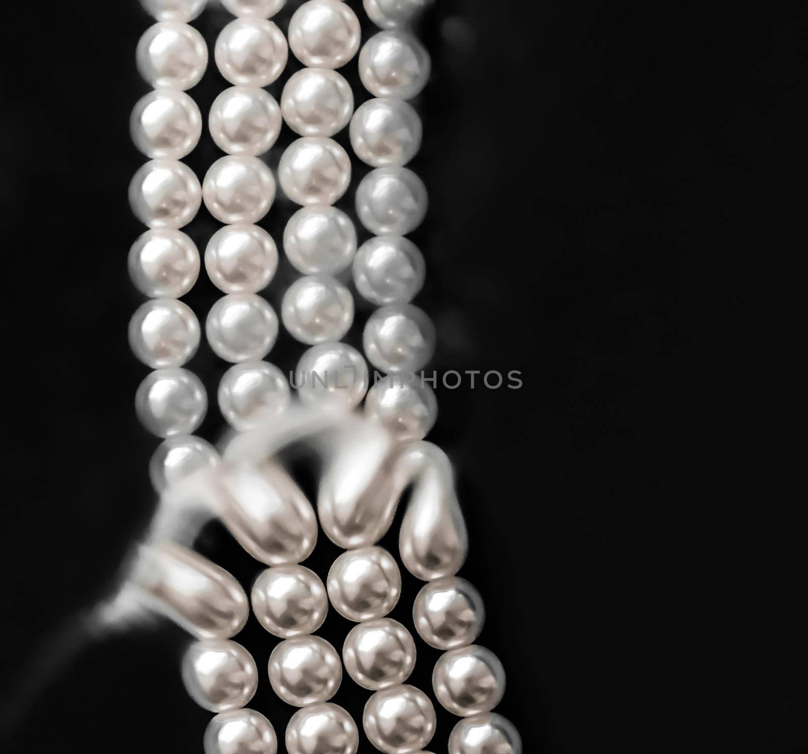 Jewelry, branding and gems concept - Coastal jewellery fashion, pearl necklace under black water background, glamour style present and chic gift for luxury jewelery brand, holiday banner design