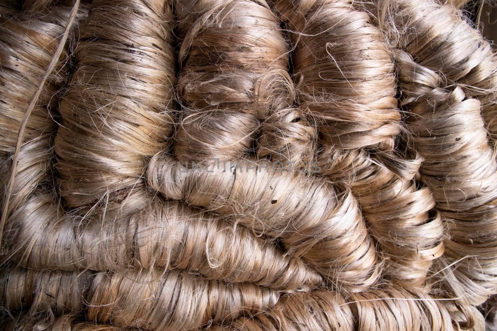 A thick bundle of Golden jute fiber Texture Background