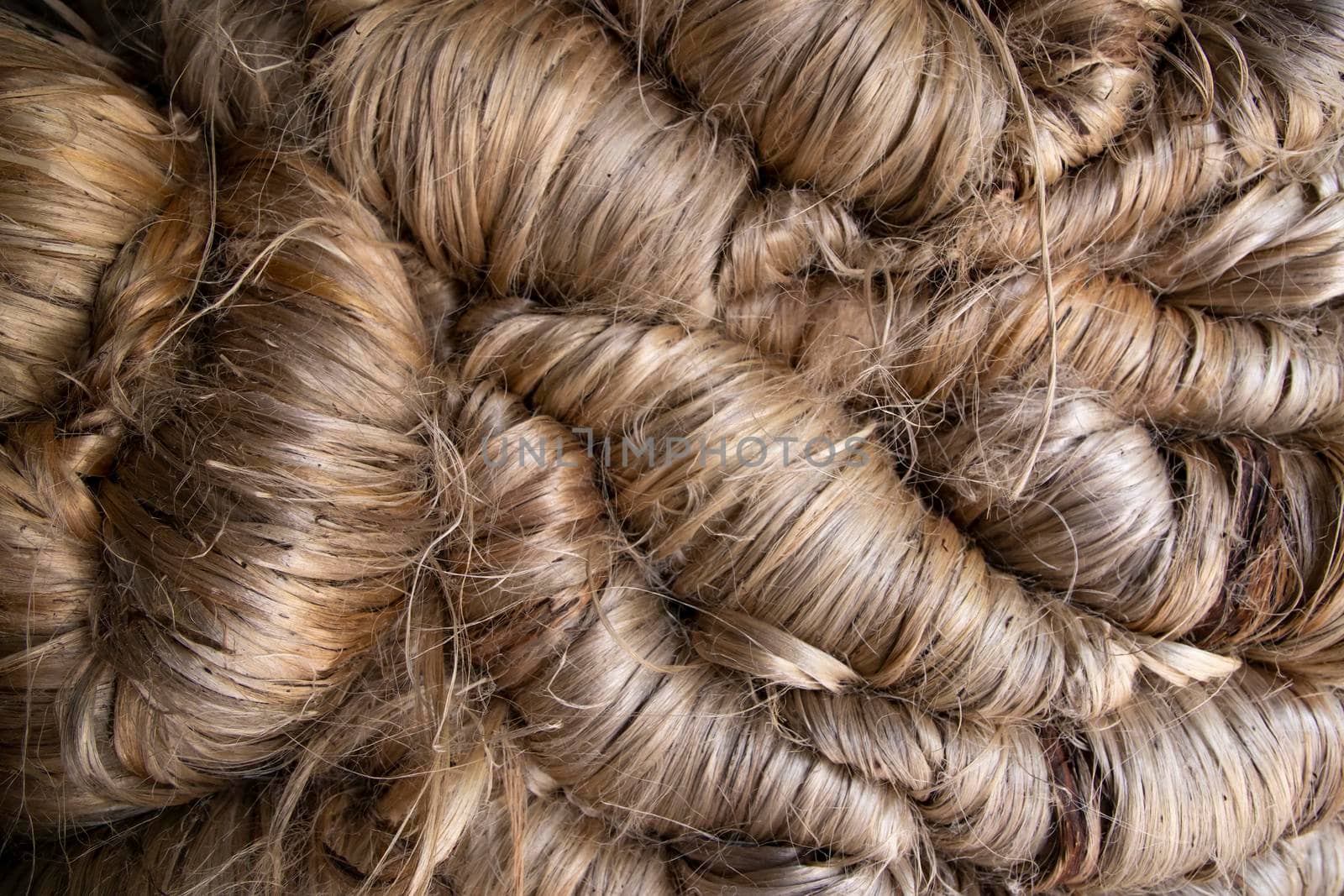 A thick bundle of Golden jute fiber Texture Background