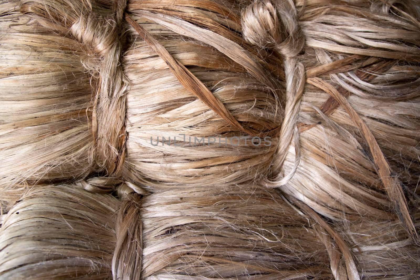 A thick bundle of Golden jute fiber Texture Background