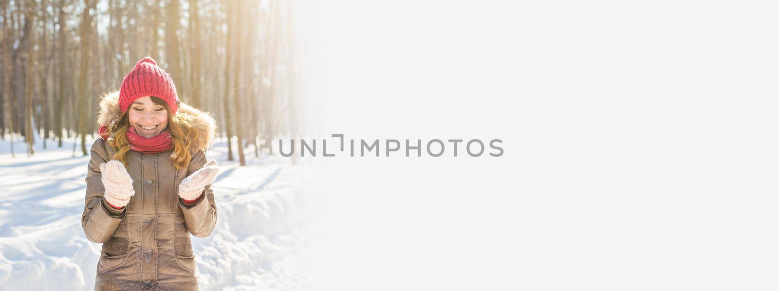 Banner Beauty Girl Blowing Snow in frosty winter Park copy space. Outdoors. Flying Snowflakes. by Satura86
