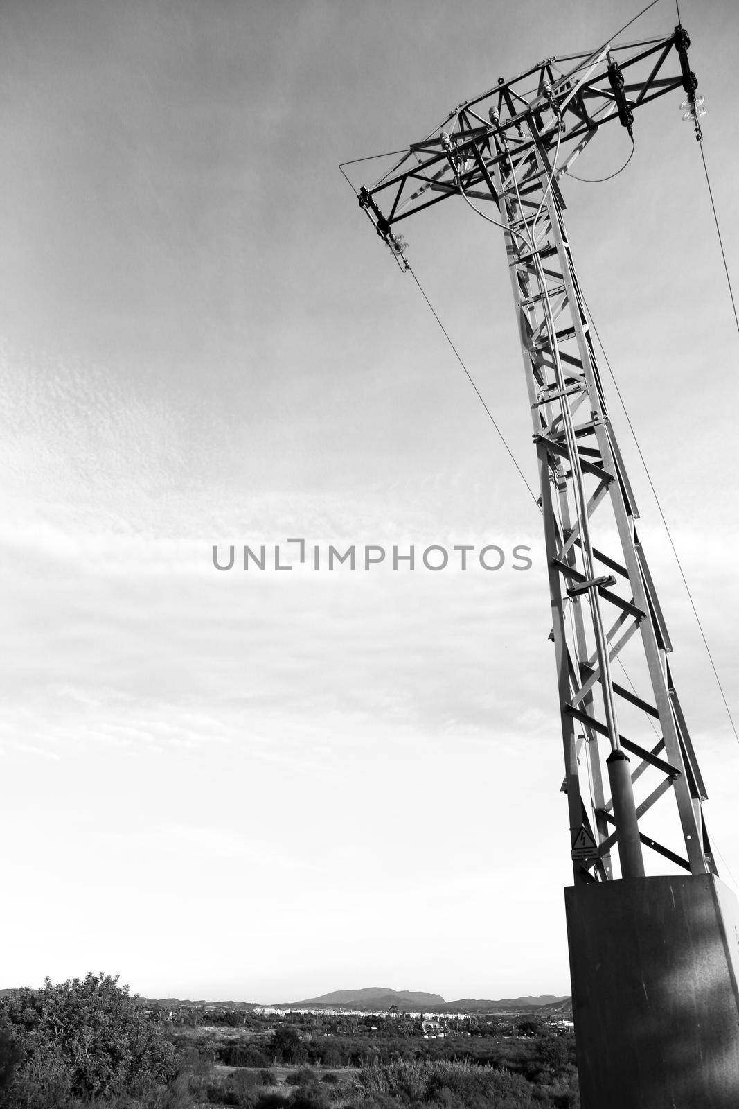 Power lines tower under clear sky in the countryside in Spain