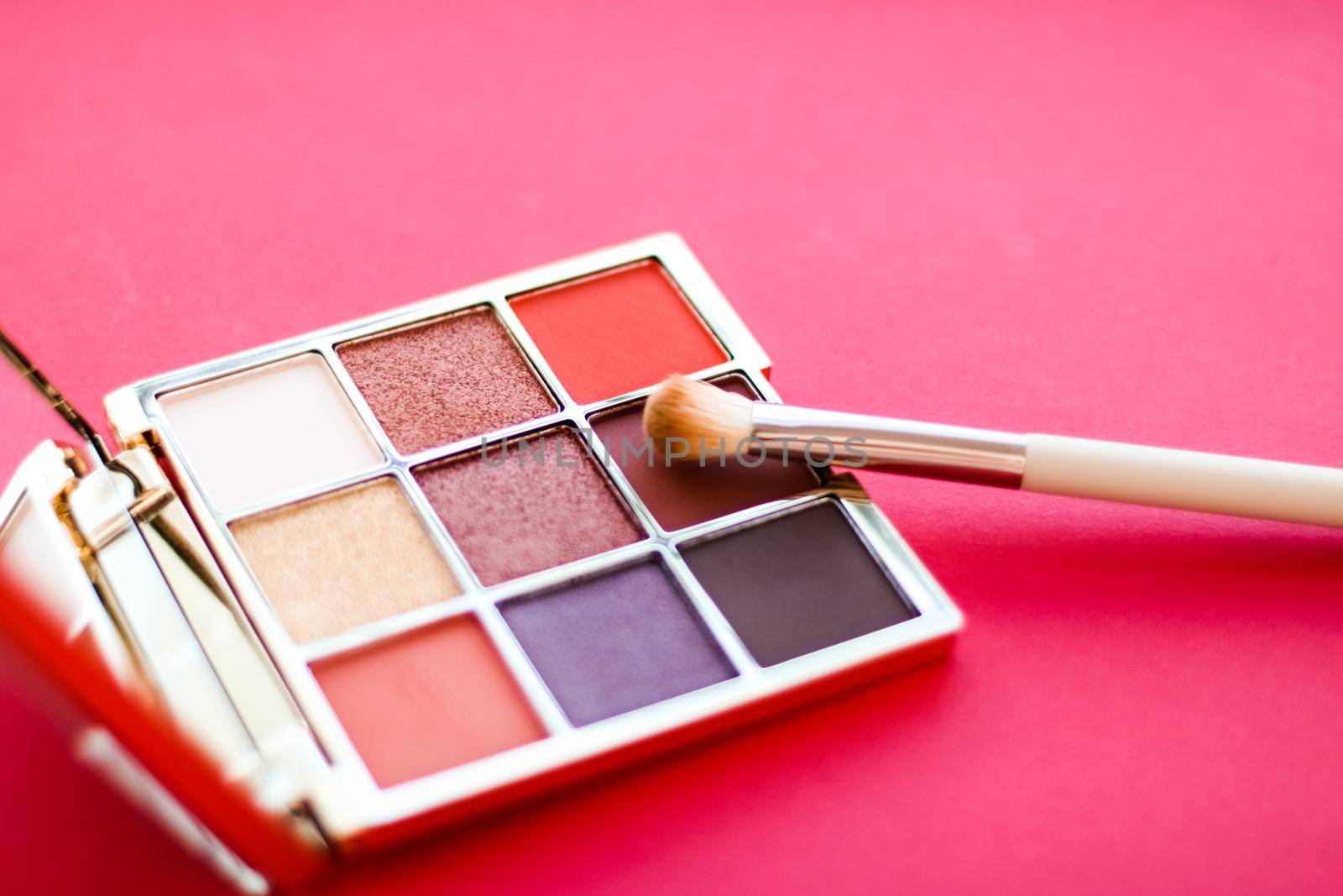 Cosmetic branding, mua and girly concept - Eyeshadow palette and make-up brush on red background, eye shadows cosmetics product for luxury beauty brand promotion and holiday fashion blog design