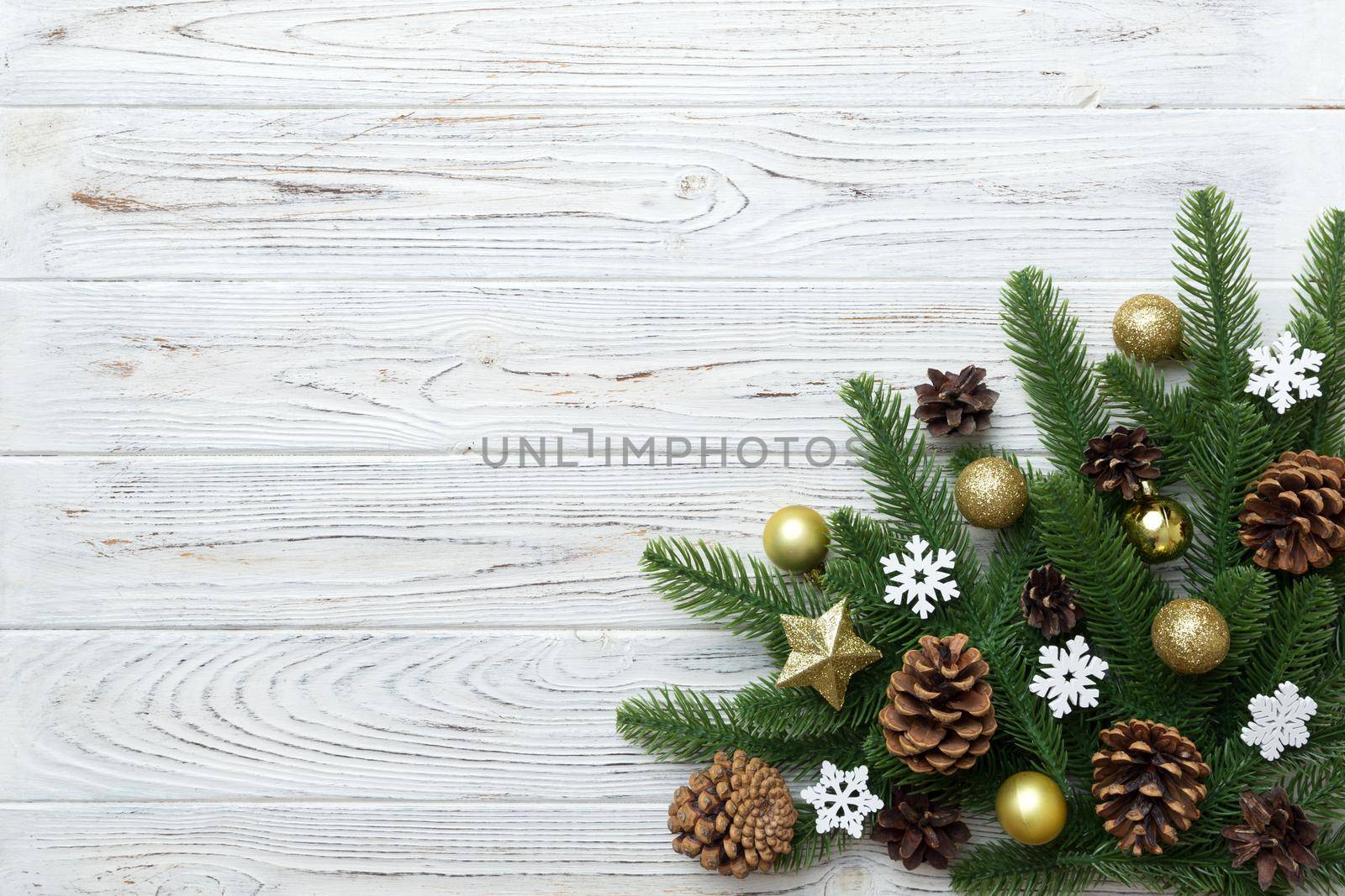 Christmas background with fir branches and Christmas decor. Top view, copy space for text.