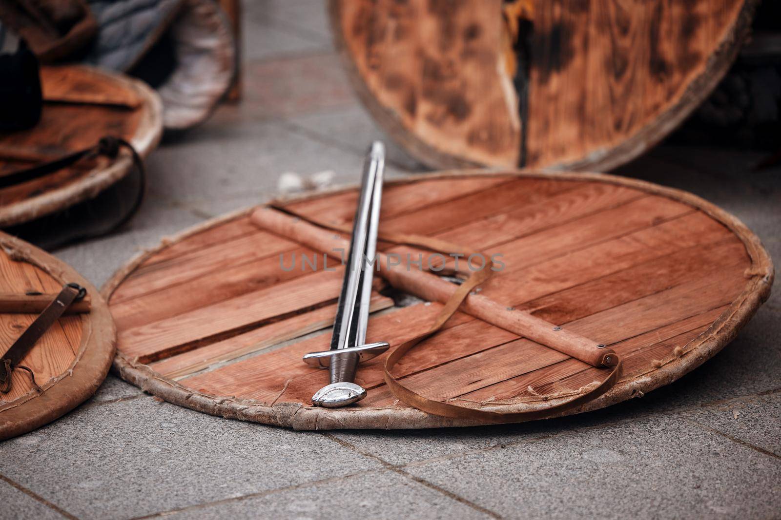 Wood shield and sword. Weapons of the Medieval Warrior. Reconstruction of medieval military equipment.