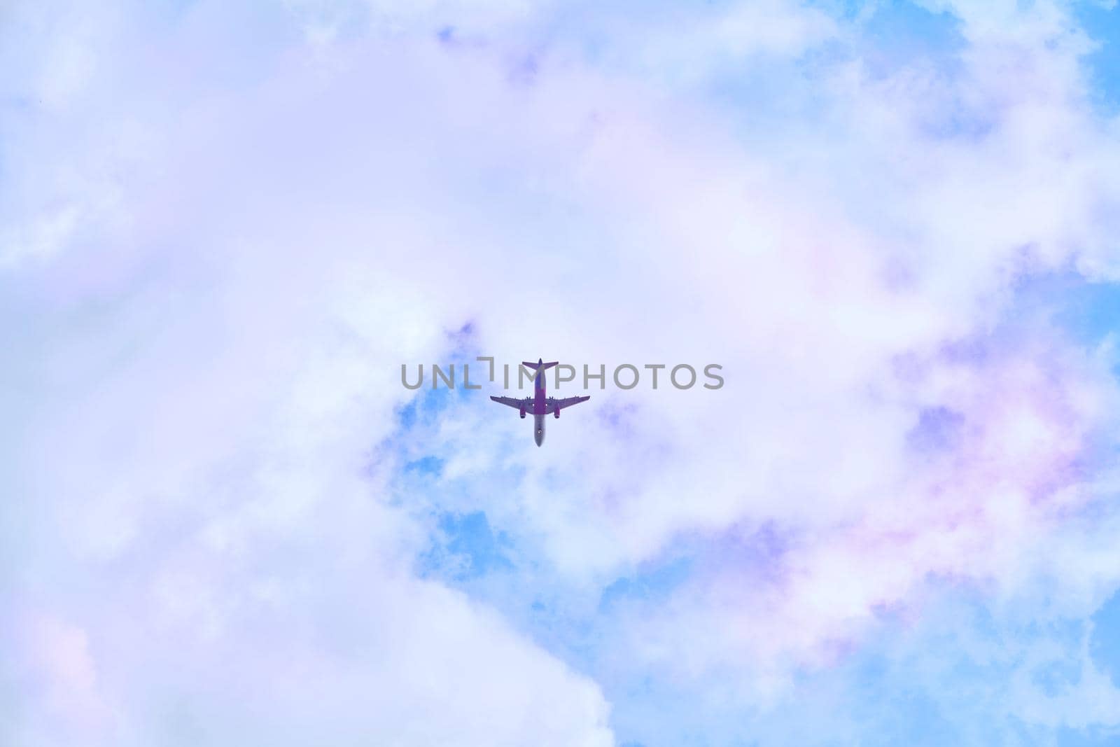 a flat surface on which a straight line joining any two points on it would wholly lie. Red passenger plane in blue sky with pink clouds