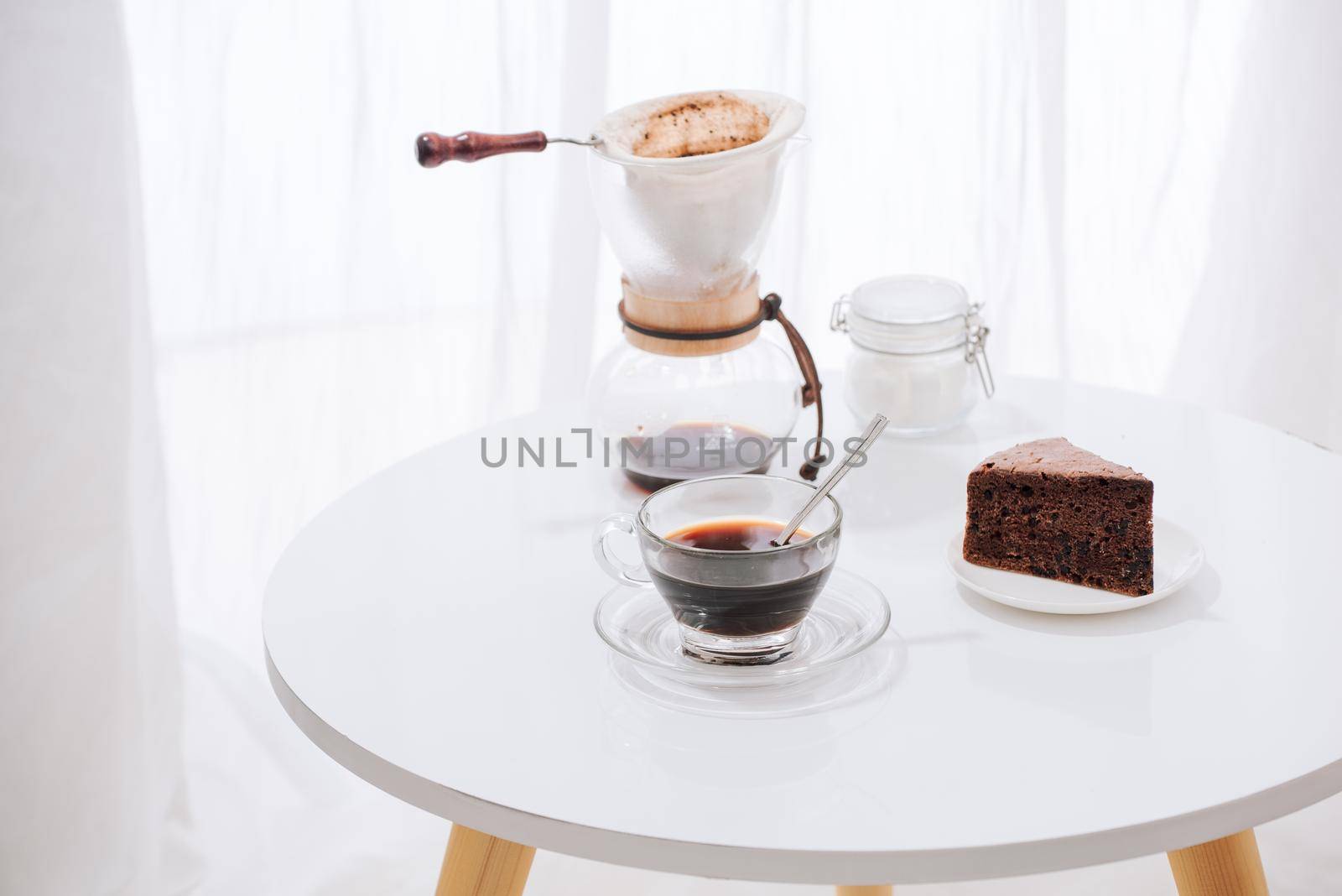 Drip coffee (dripper) and drip ground coffee with glass drip pot, cup and chocolate cake by makidotvn