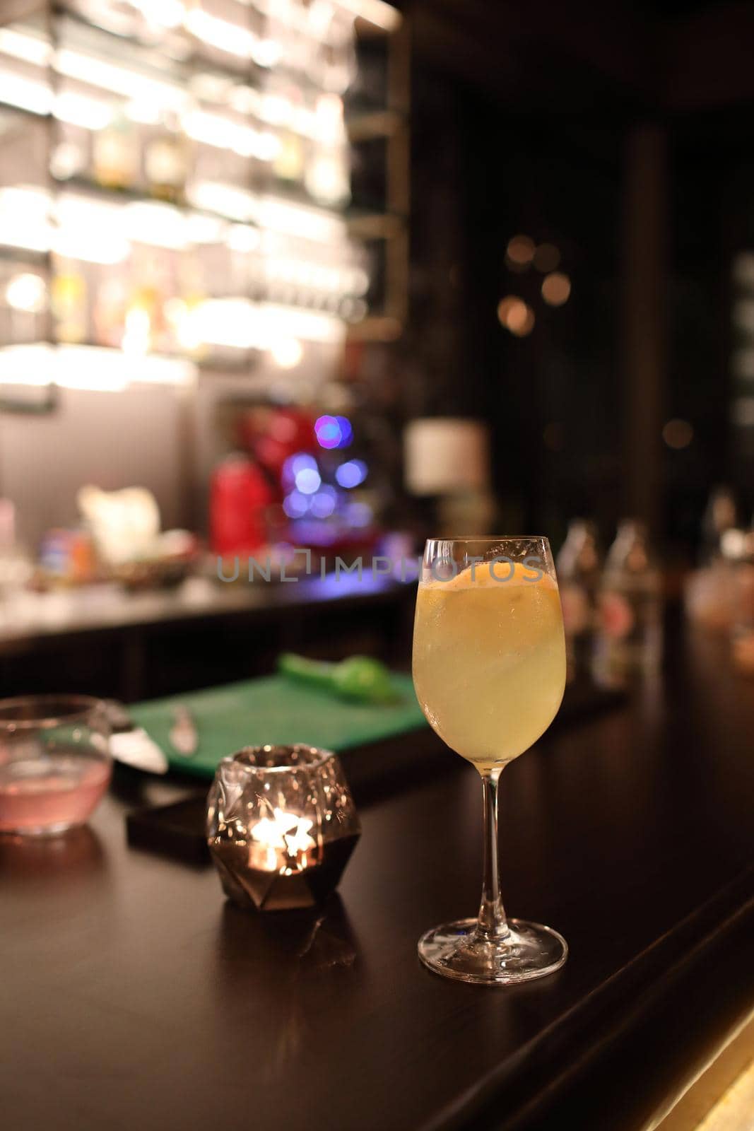 cocktails in glasses on bar counter in pup or restaurant