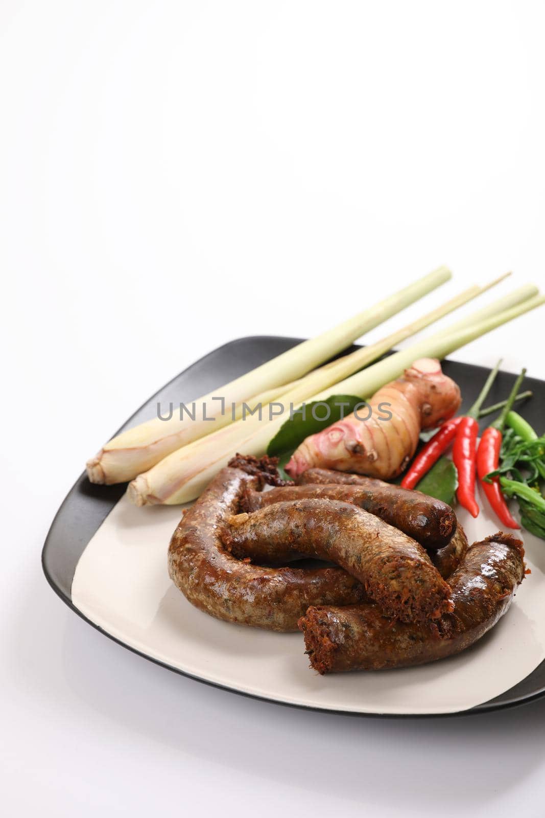 Local Northern Thai food , Northern Thai spicy sausage street food isolated in white background by piyato