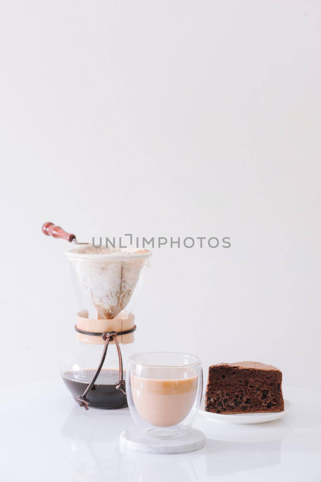 Breakfast with chocolate cake and coffee served on a beautiful living home 