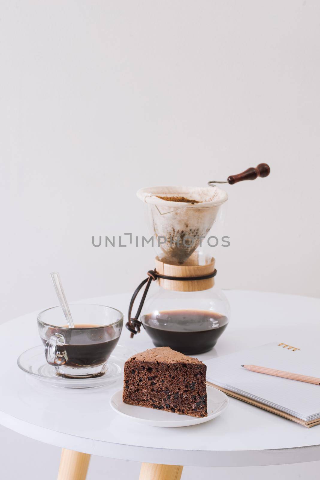 Breakfast with chocolate cake and coffee served on a beautiful living home 