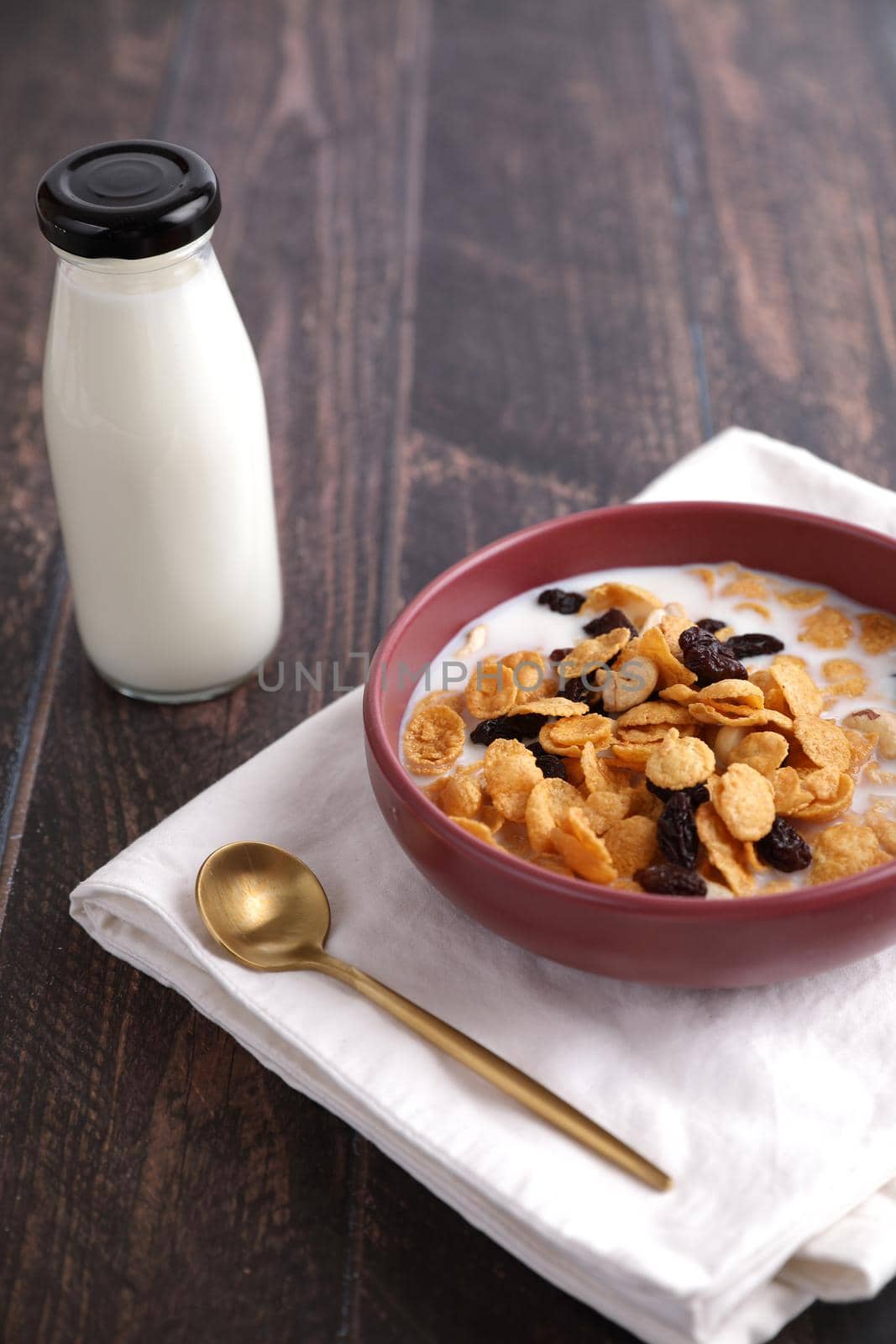 Cereal dessert with corn oat and dry fruits isolated in wood background