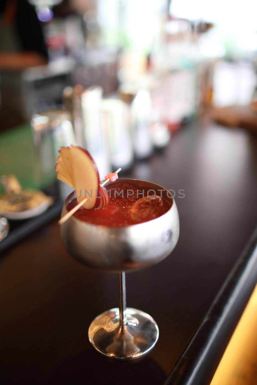 cocktails in glasses on bar counter in pup or restaurant