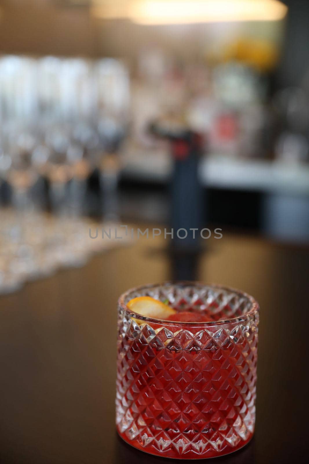 cocktails in glasses on bar counter in pup or restaurant