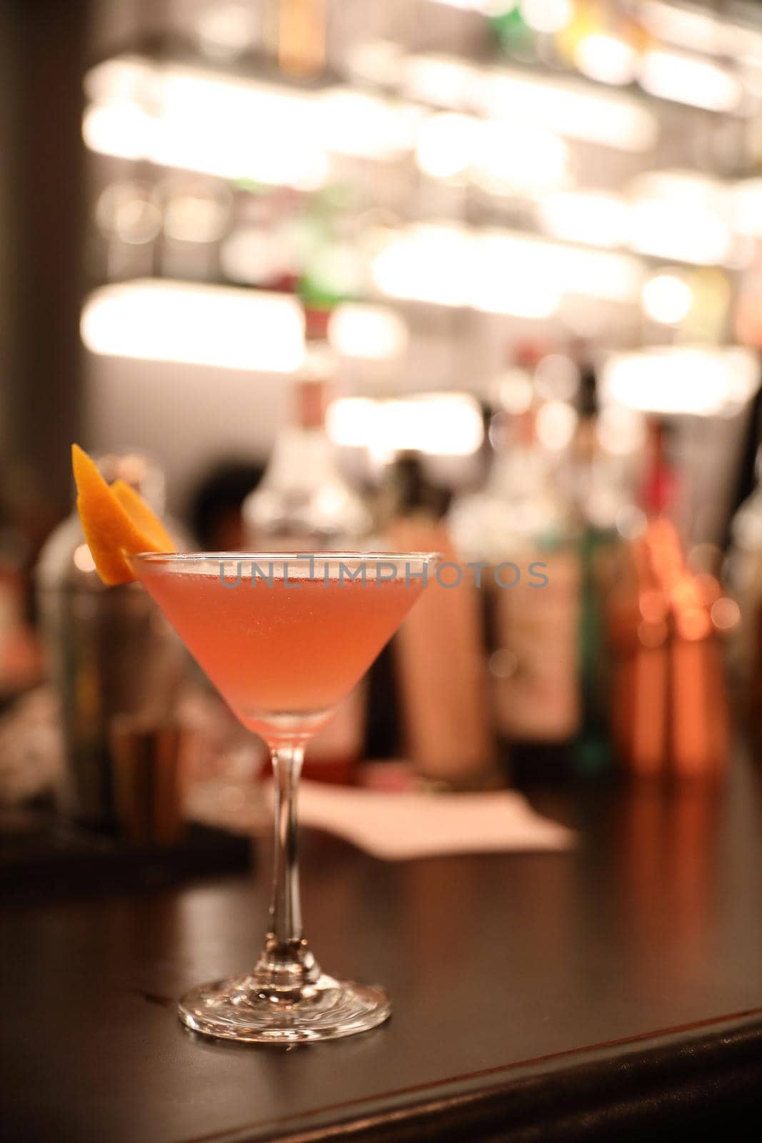 cocktails in glasses on bar counter in pup or restaurant